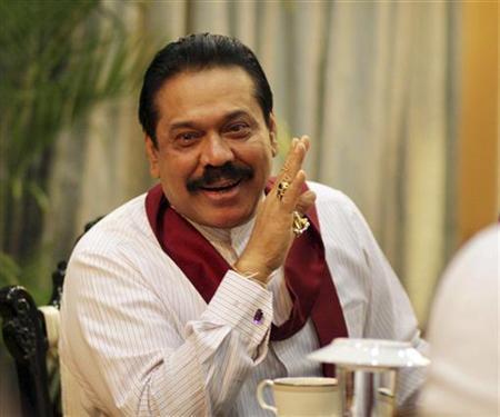 Sri Lanka's President Mahinda Rajapaksa speaks during a meeting with foreign correspondents at his office in Colombo